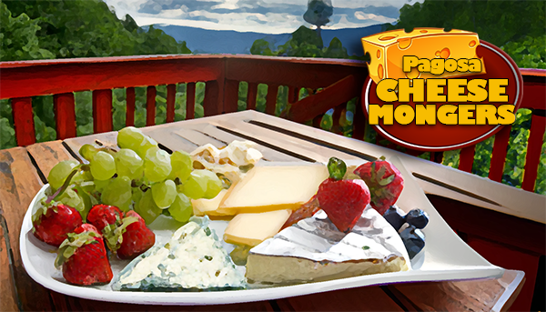 An illustrated cheese board with fruit on a deck overlooking the mountains in Pagosa Springs